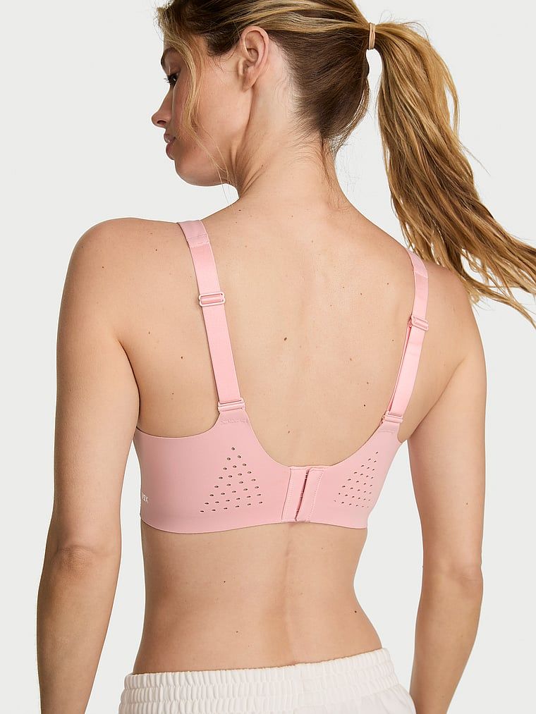 VSX Featherweight Max Maximum Support sportovní podprsenka. Produkt je růžové barvy a pochází z kolekce VSX.