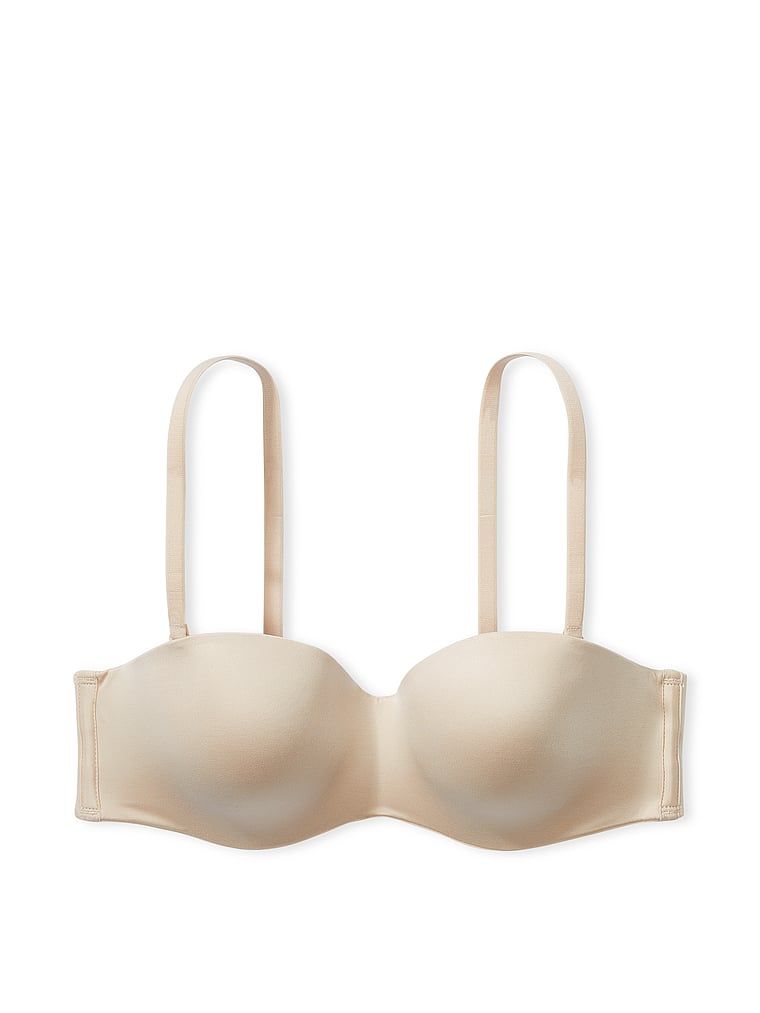 Mírně vyztužená podprsenka bez ramínek. Produkt je béžový a pochází z kolekce Body by Victoria.