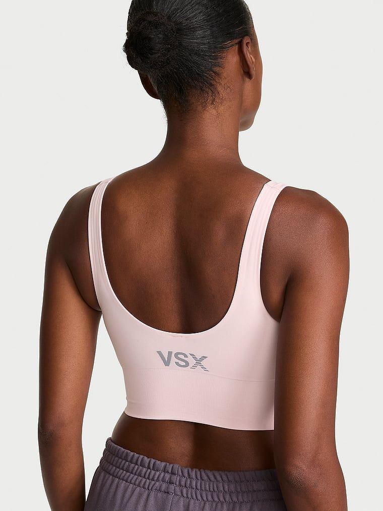 VSX Elevate sportovní podprsenka s hladkým povrchem. Produkt je růžové barvy a pochází z kolekce VSX.