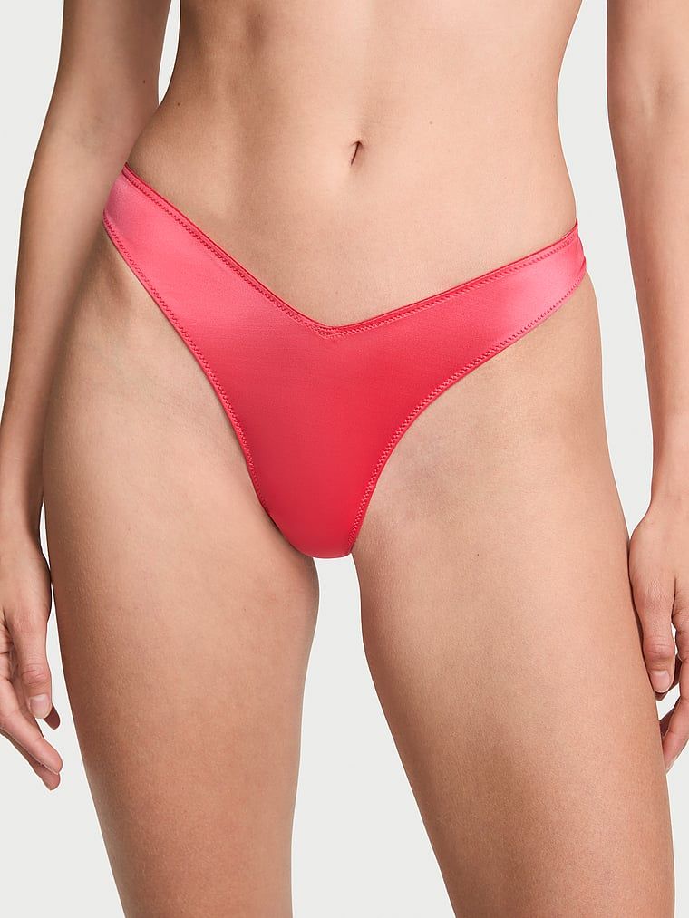 Tanga s ramínky vzadu a vysoko střiženými rameny na zádech. Produkt je červené barvy a pochází z kolekce Very Sexy.
