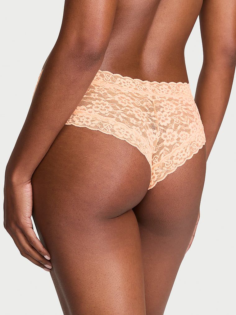 Krajkové krajkové kalhotky Laceky. Produkt je oranžové barvy a pochází z kolekce Lacie.