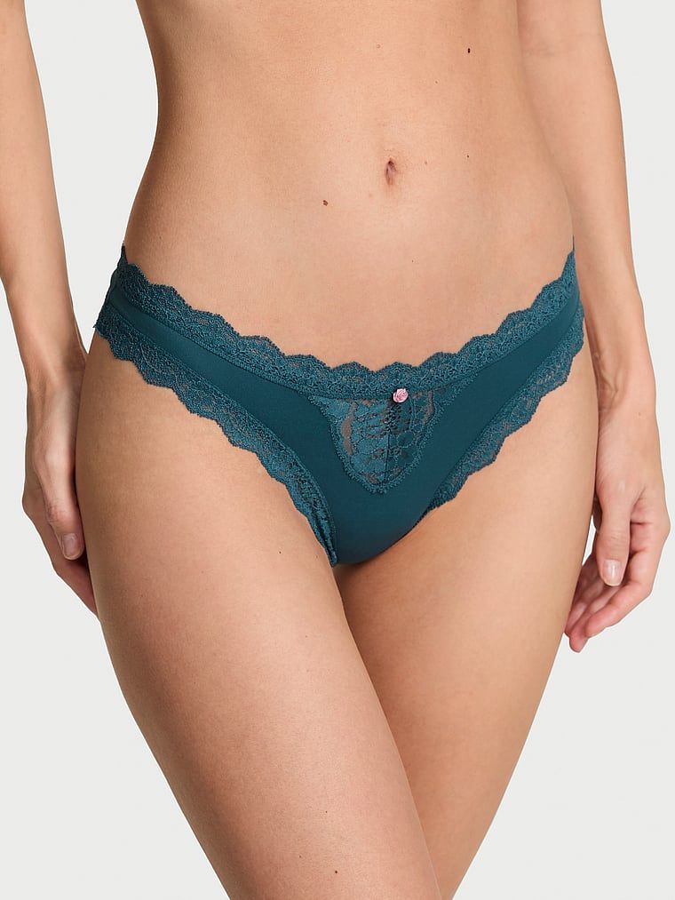 Tanga s krajkou Lace Trim. Produkt má modrou barvu a pochází z kolekce Dream Angels.