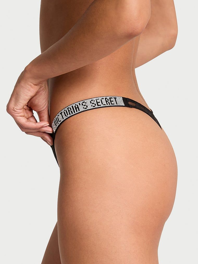 Řemínek Shine Strap Rose Krajka tanga. Produkt je černý a pochází z kolekce Very Sexy.