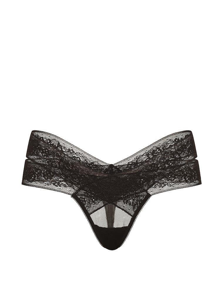 Tanga s výstřihy a krajkou s páskami. Produkt je černý a pochází z kolekce Very Sexy.