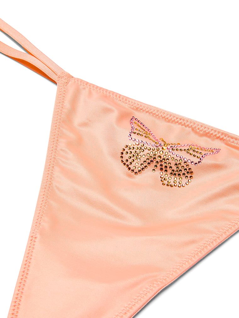 Twinkle Butterfly saténové tanga. Produkt je béžové barvy a pochází z kolekce Dream Angels.