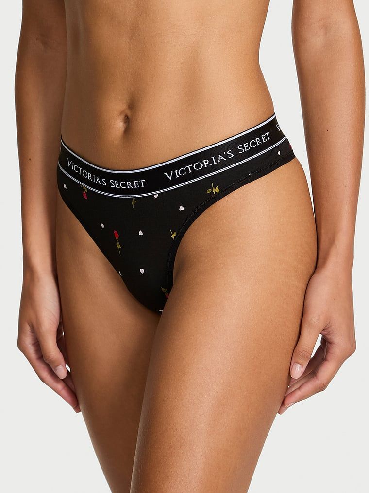 Bavlněné tanga s logem v pase. Produkt má květinovou barvu a pochází z kolekce Cotton.