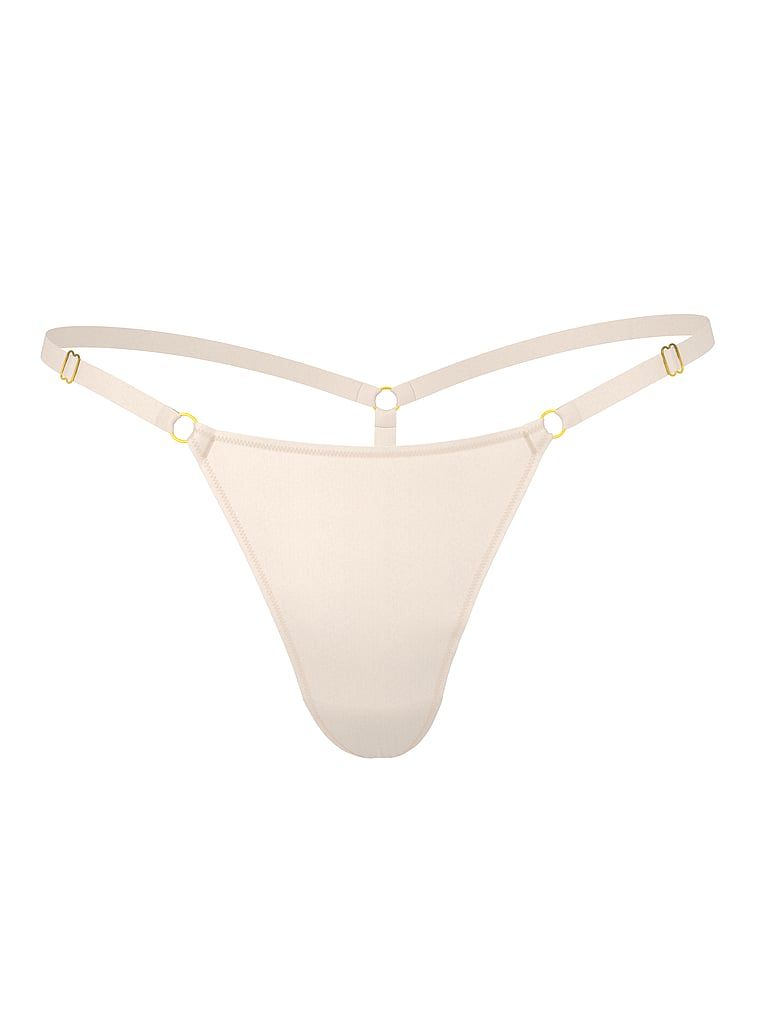 Tanga s nastavitelnými popruhy Hardware. Produkt je béžové barvy a pochází z kolekce Body by Victoria.