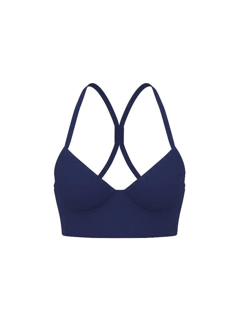 VSX LUXMarl sportovní podprsenka Racerback. Produkt je vzorovaný a pochází z kolekce VSX.