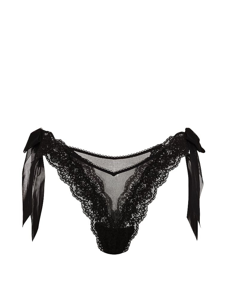 Brazilské kalhotky s mašlemi po stranách, krajka a síťovaná boční mašle. Produkt je černý a pochází z kolekce Dream Angels.