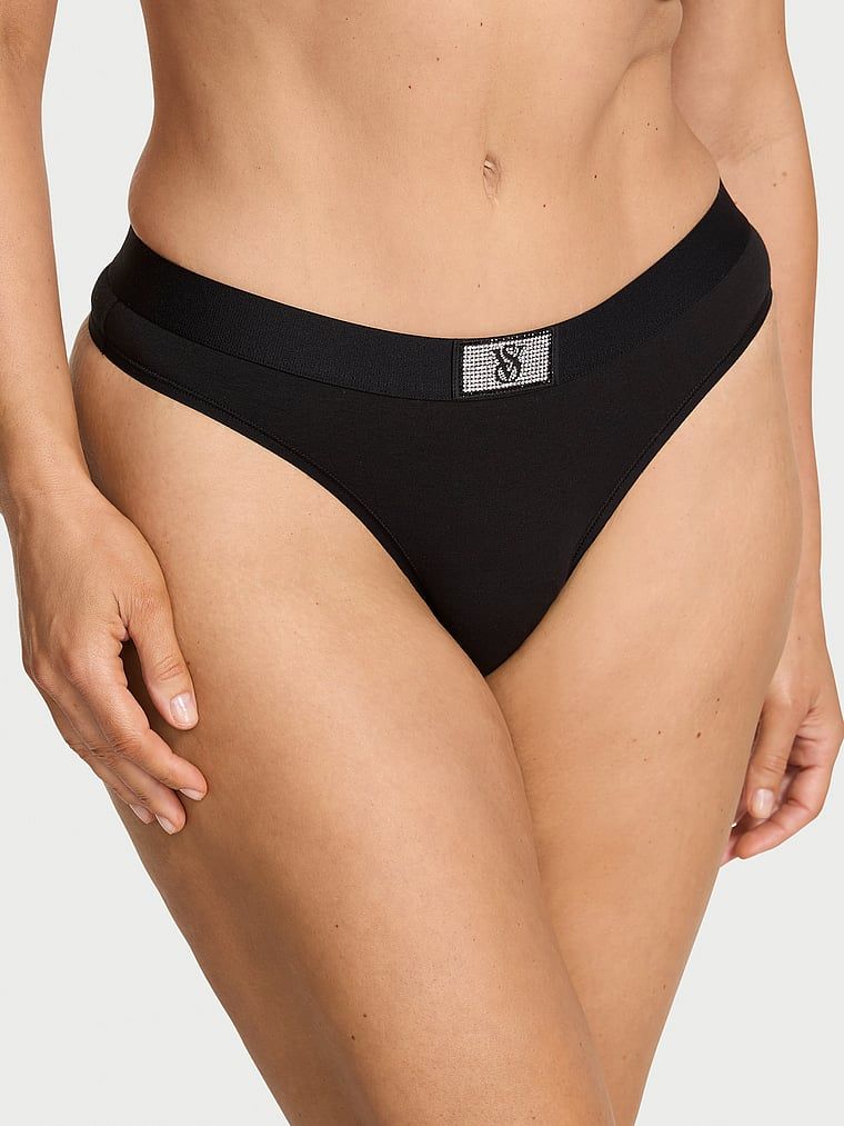 Bavlněná tanga s lesklým logem Shine Patch. Výrobek je černý a pochází z kolekce Cotton.