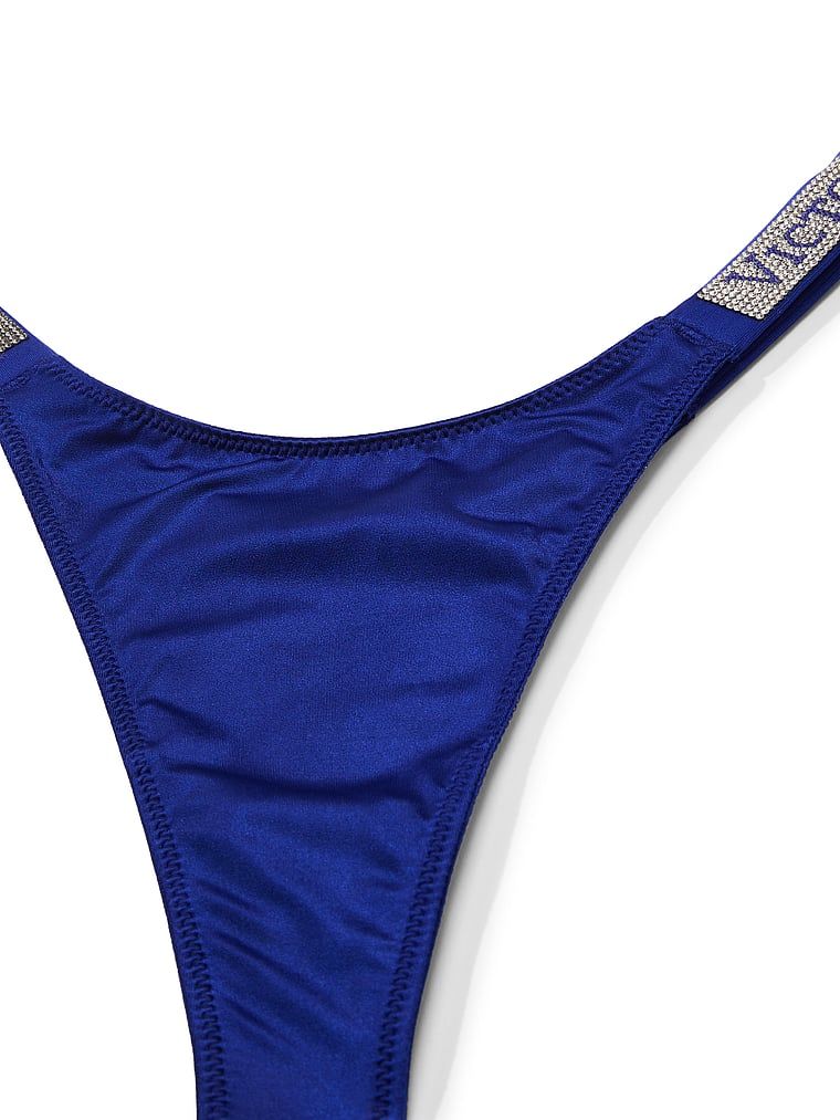 Tanga s lesklými ramínky Shine Strap. Produkt je modré barvy a pochází z kolekce Very Sexy.