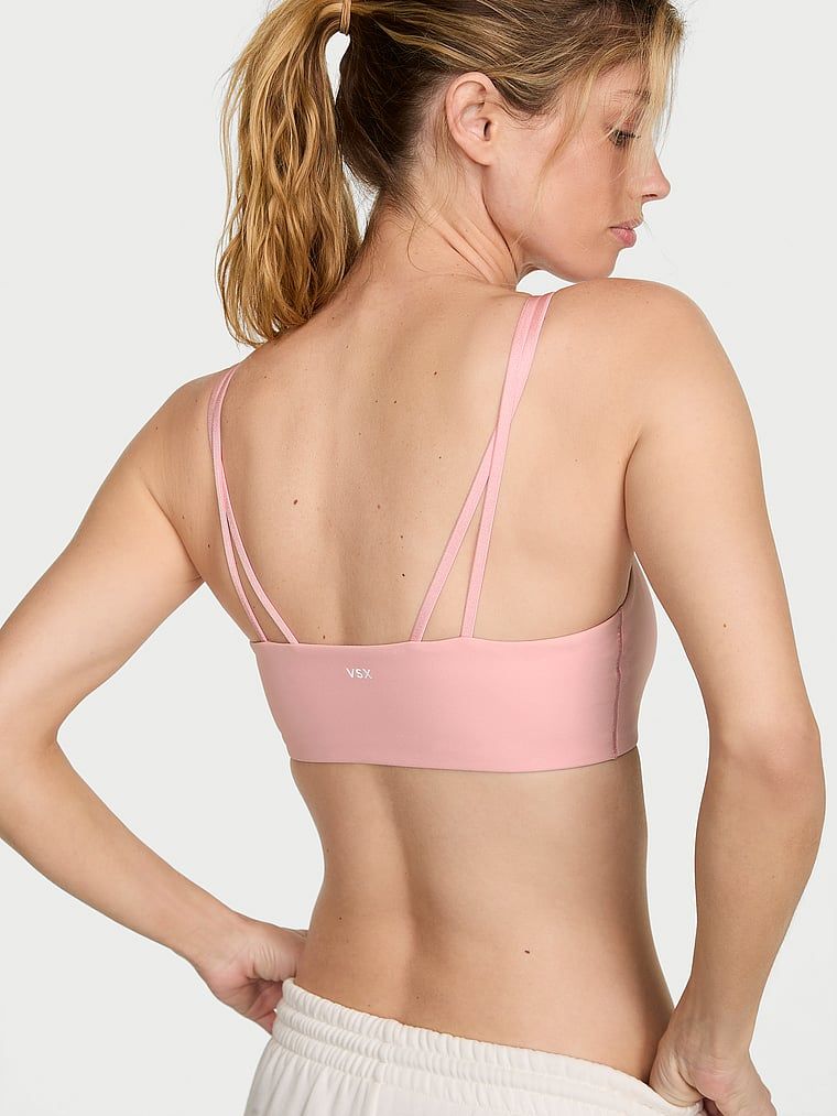 VSX Elevate sportovní podprsenka. Produkt je růžové barvy a pochází z kolekce VSX.