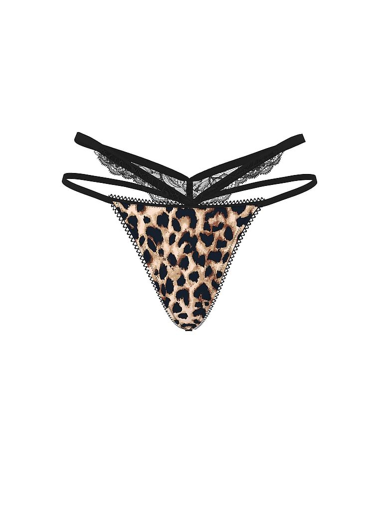 Tanga s krajkou a výstřihy po stranách. Produkt je vzorovaný a pochází z kolekce Very Sexy.