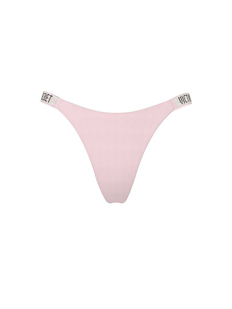 Tanga s lesklými popruhy Shine Strap. Produkt má růžovou barvu a pochází z kolekce Very Sexy.