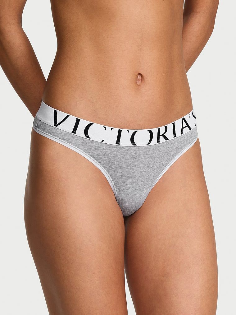 Logo s výbuchem bavlněných tang. Produkt je šedobarevný a pochází z kolekce Cotton.