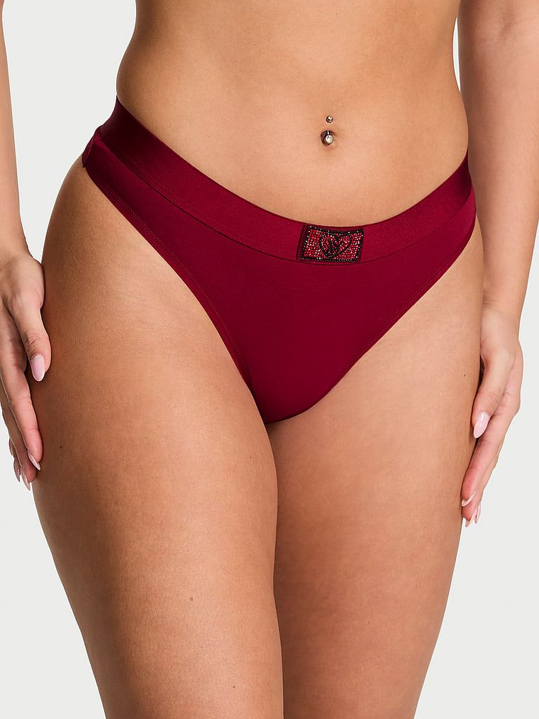 Bavlněné tanga s lesklým logem Heart Shine Patch. Produkt je červené barvy a pochází z kolekce Cotton.