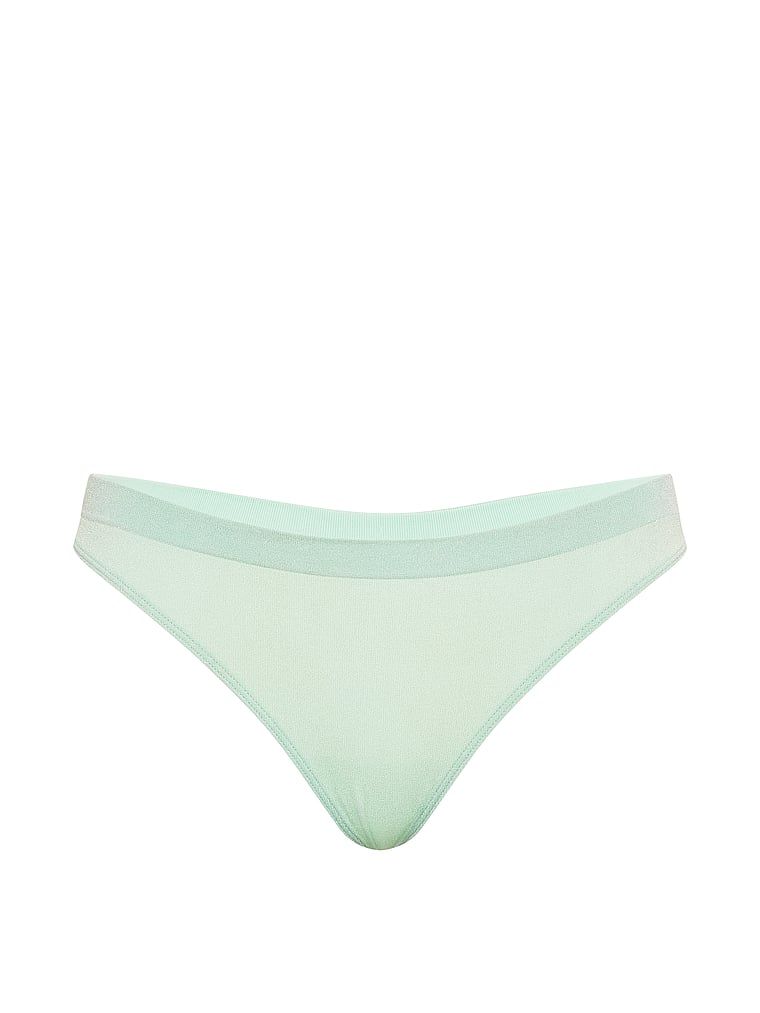 Tanga vyrobená z lesklého materiálu Shimmer. Produkt je zelené barvy a pochází z kolekce Seamless.