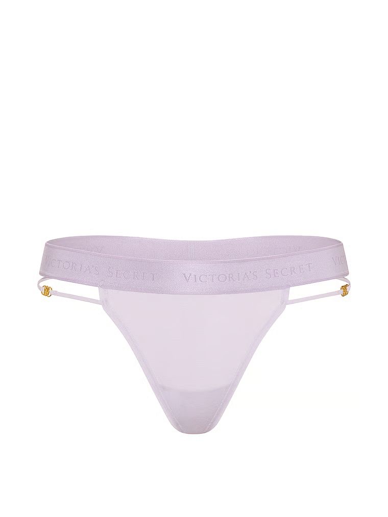 Bavlněné tanga s logem a ramínky s páskami. Produkt je fialové barvy a pochází z kolekce Cotton.