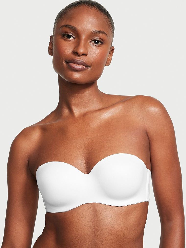 Mírně vyztužená podprsenka bez ramínek. Produkt je bílý a pochází z kolekce Body by Victoria.