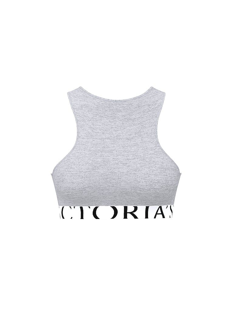 Bavlněná podprsenka s explodujícím logem s vysokým límcem. Produkt je šedé barvy a pochází z kolekce triček.