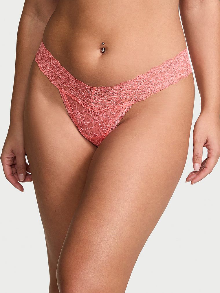 Krajková krajková tanga. Produkt je oranžový a pochází z kolekce Lacie.