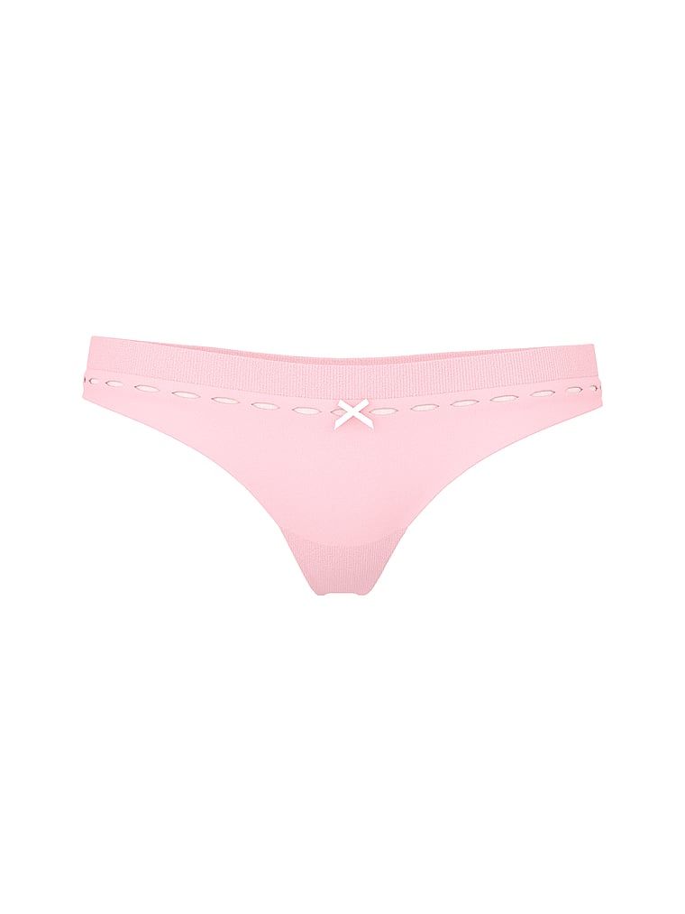 Tanga s bezšvovým otvorem na stuhu. Produkt je růžové barvy a pochází z kolekce Seamless.