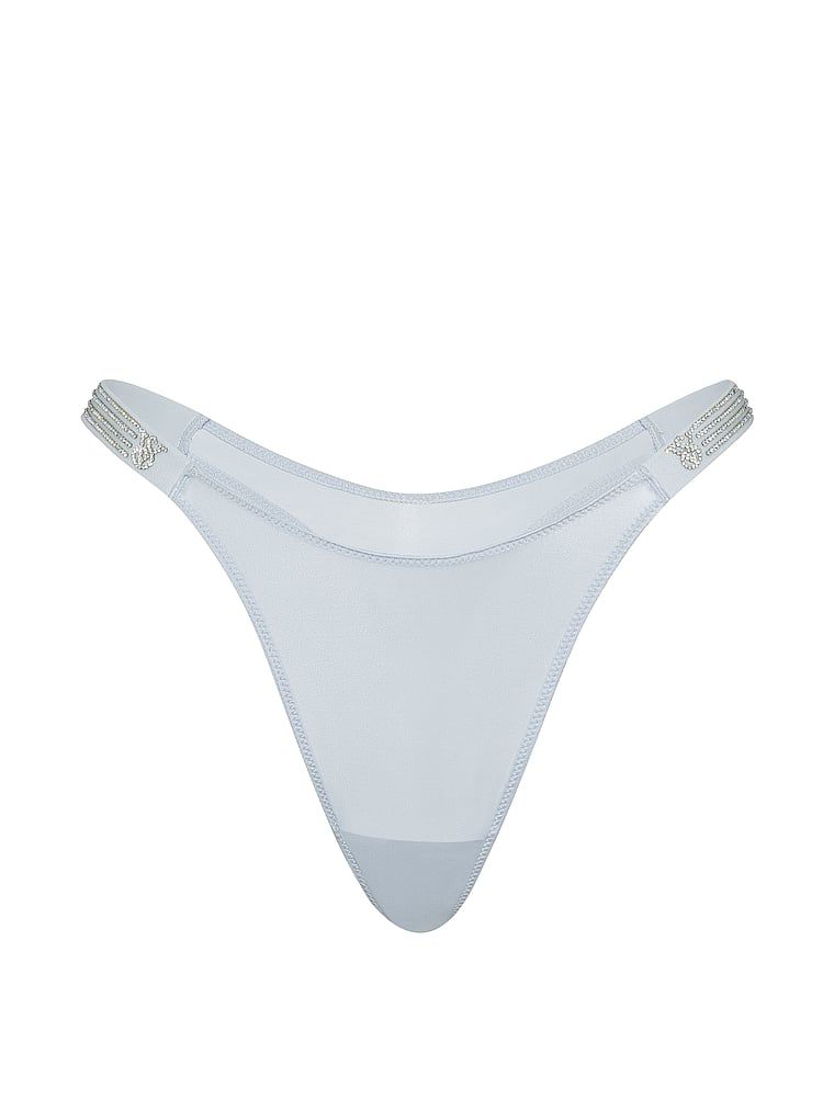 Tanga s lesklými pruhy Shine. Produkt je modré barvy a pochází z kolekce Very Sexy.