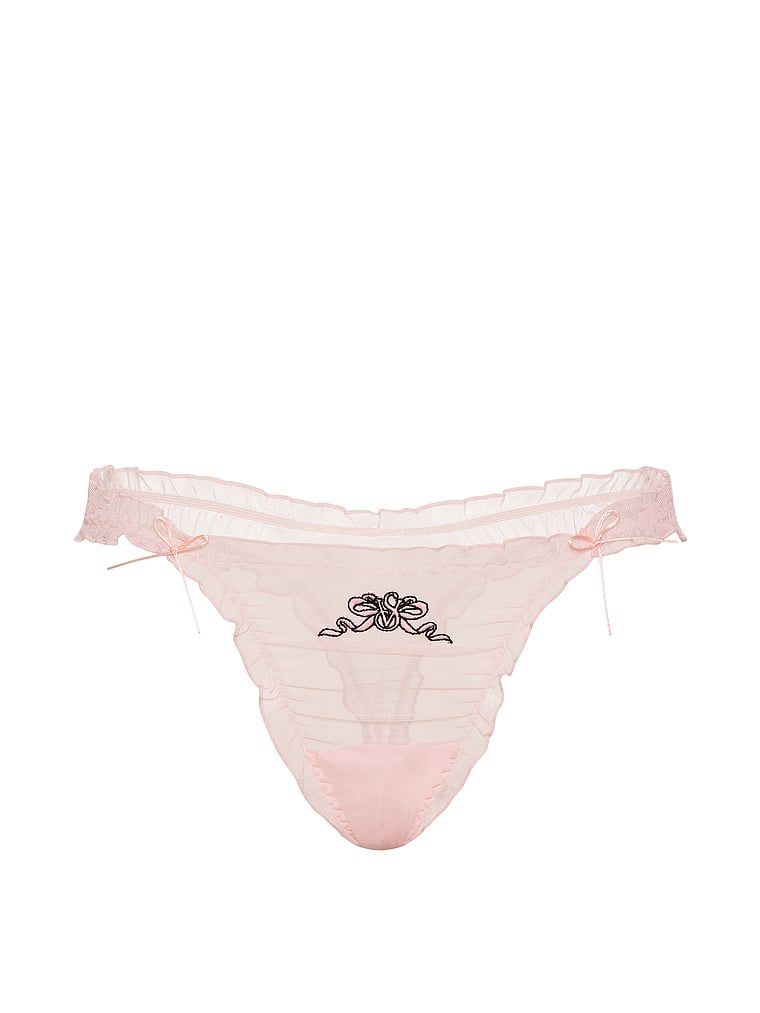 Tanga s volánky a síťovanými mašlemi. Produkt je růžové barvy a pochází z kolekce Dream Angels.