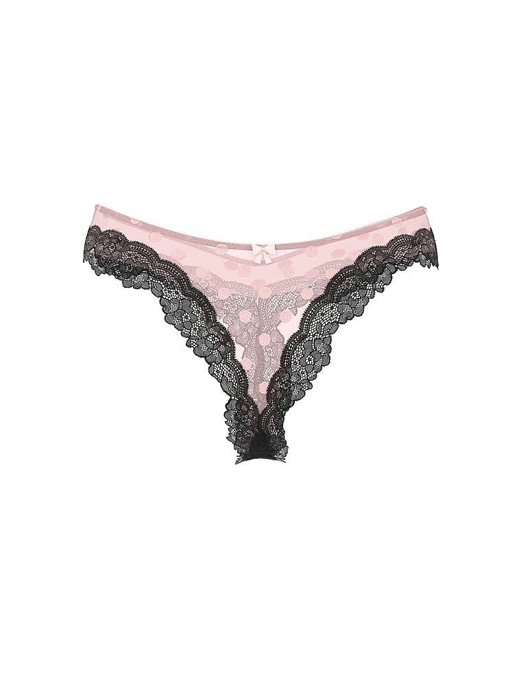 Tease Sheer Dot síťované tanga s vysokým výstřihem a vysokými nohavičkami. Produkt je vzorovaný a pochází z kolekce Victoria's Secret.