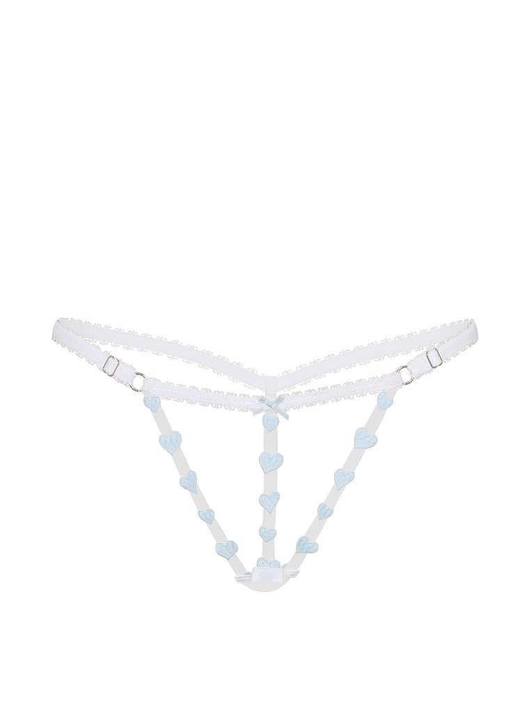 Tanga bez stepu Lákadlo s ramínky. Produkt je vzorovaný a pochází z kolekce Victoria's Secret.