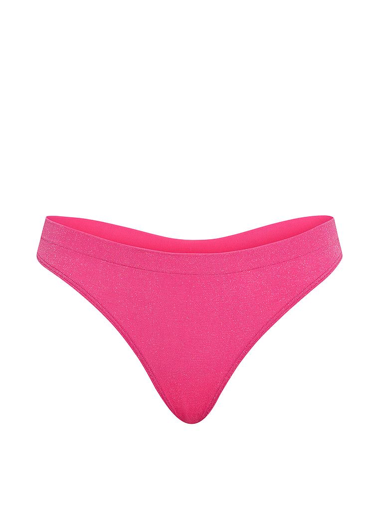 Tanga vyrobená z lesklého materiálu Shimmer. Produkt je růžové barvy a pochází z kolekce Seamless.