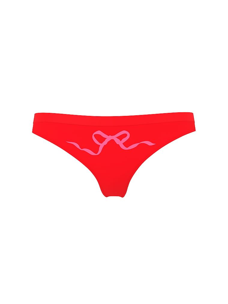 Tanga s bezešvou mašlí. Produkt má červenou barvu a pochází z kolekce Bezešvé.