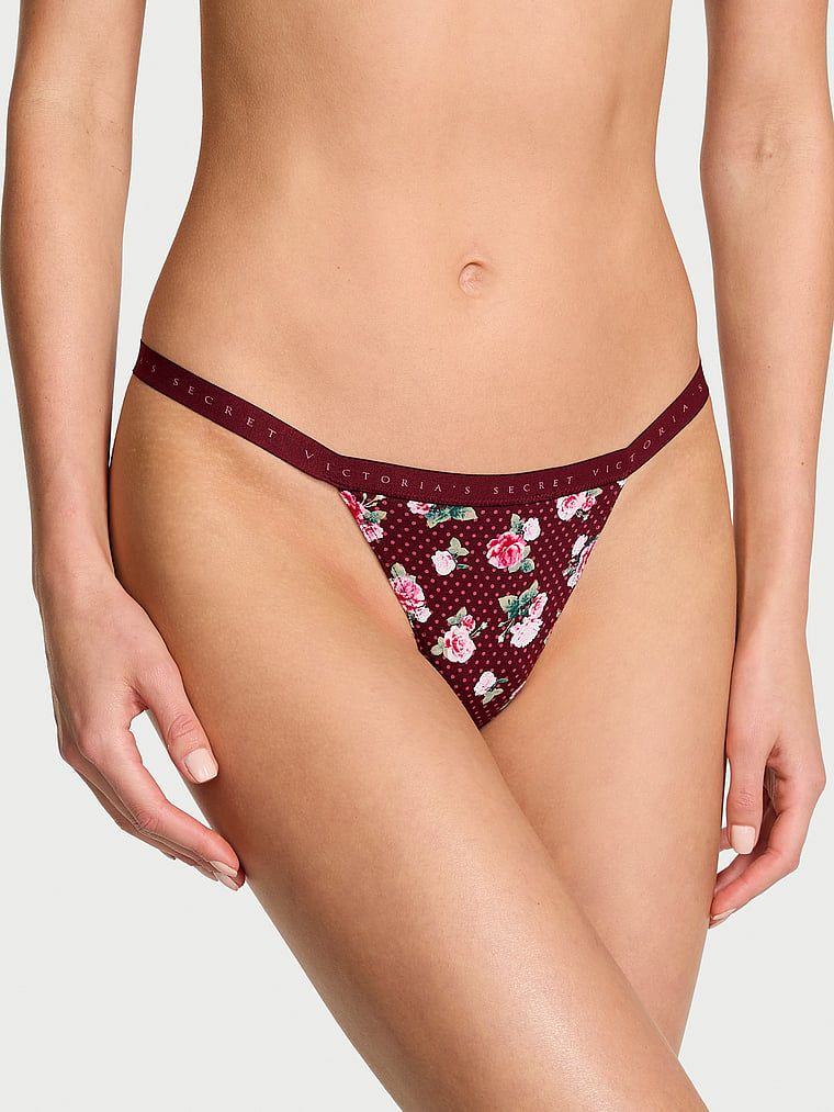 Elastická bavlněná tanga. Produkt má květinovou barvu a pochází z kolekce Victoria's Secret.