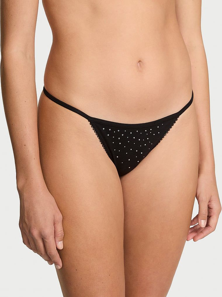 Bavlněná tanga s třpytivými flitry. Produkt je černý a pochází z kolekce Victoria's Secret.