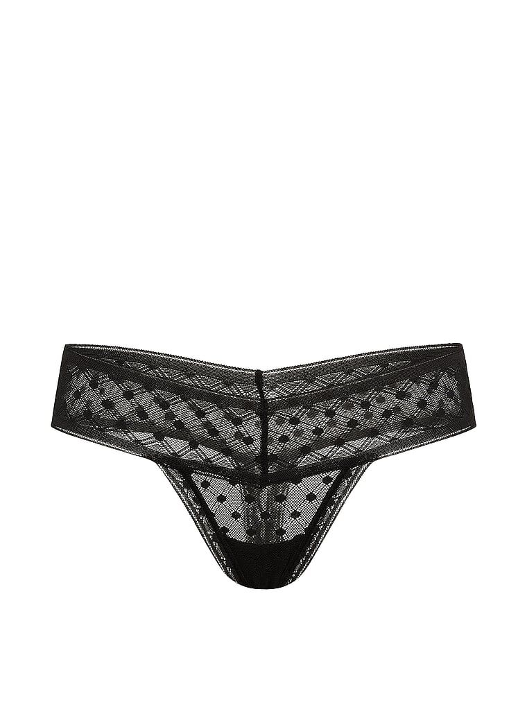 Tanga vyrobená z krajky Dot Geo. Produkt je černý a pochází z kolekce Lacie.
