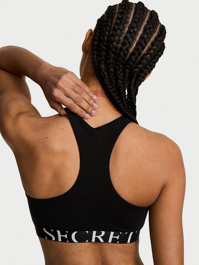 Bavlněná podprsenka s explodujícím logem s vysokým límcem. Produkt je černý a pochází z kolekce triček.