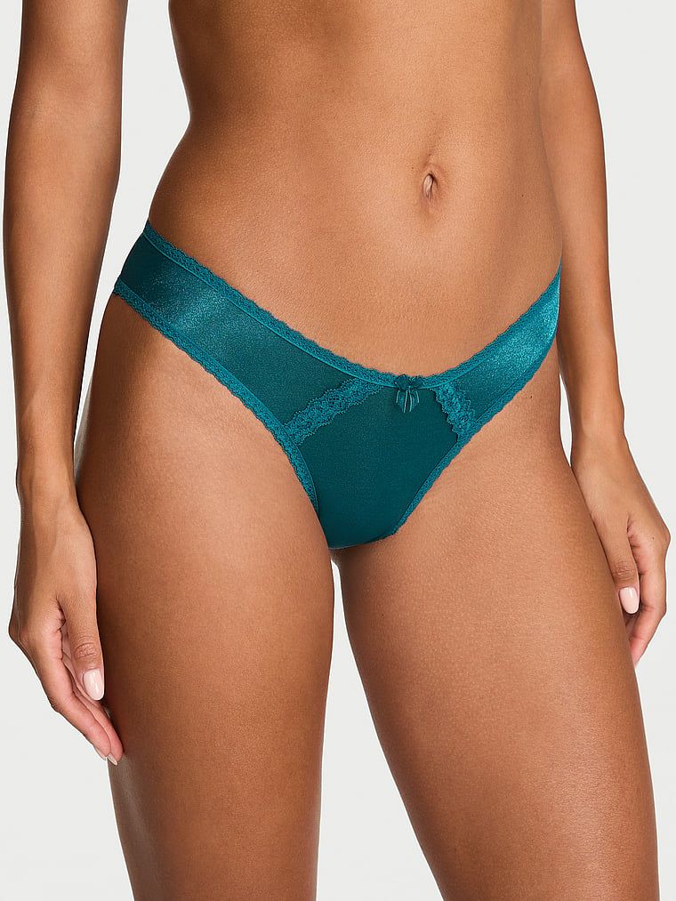 Lesklé brazilské kalhotky s výřezy vzadu Průsvitné brazilské třpytivé brazilské. Produkt je modré barvy a pochází z kolekce Dream Angels.