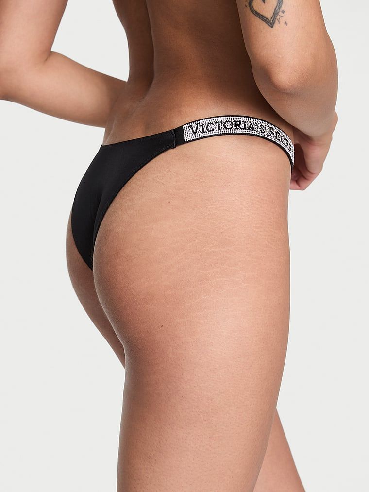 Brazilské kalhotky s brazilskými proužky Shine Strap. Produkt je černý a pochází z kolekce Very Sexy.