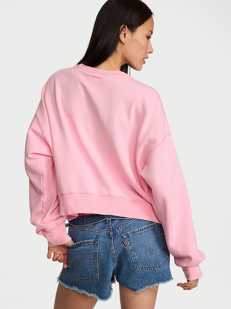 Bavlněná krátká mikina Fashion Show 2026. Produkt je růžové barvy a pochází z kolekce Angel Essentials.