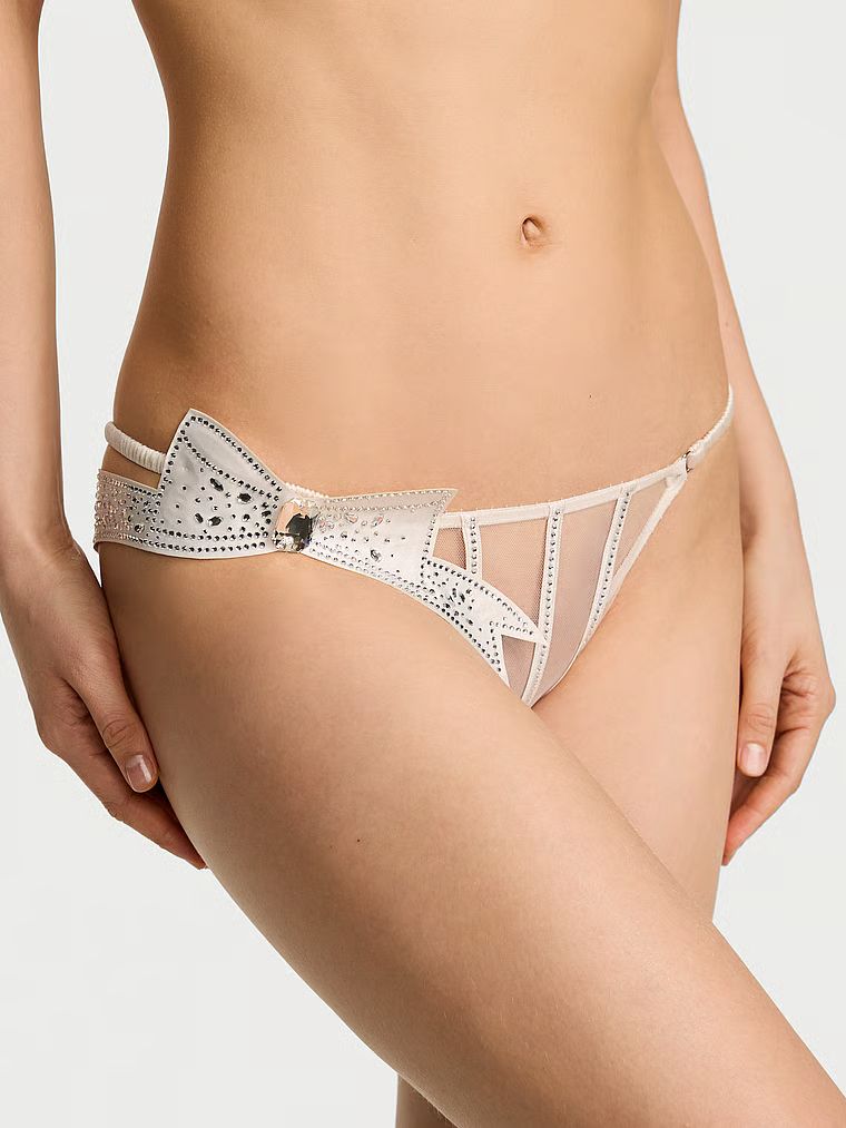 Kalhotky s mašlí Atelier průsvitné bikiny s mašlí. Produkt je bílý a pochází z kolekce Dream Angels.